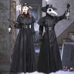 two people dressed in costumes standing next to each other