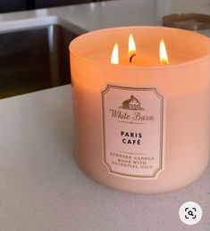 a pink candle sitting on top of a counter