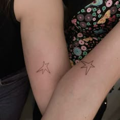 two small stars on the back of their legs, one is smaller than the other