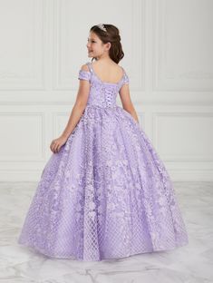 Be the center of attention in this floral lace appliqued long off the shoulder dress with A-line skirt by House of Wu Quinceanera Collection 26930. Have a magical moment in this gorgeous cold-shoulder style ball gown. The V-neck bodice is accented with crystal beaded for a touch of sparkle. The full lace skirt will have everyone watching. This look is finished with a corset back and a sweep train. House of Wu Quinceanera Collection Fall 2019 Style Number: 26930 Fabric: Lace/Glitter Tulle Colors: Vestido Color Lila, Quinceanera Collection, Beautiful Ball Gowns, Girls Ball Gown, Best Designer Dresses, Cold Shoulder Styles, Girls Pageant Dresses, Kids Gown, Quinceanera Dress