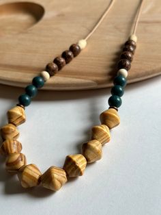 Wood and glass beads are strung on a natural leather cord. Necklace is extra long in length (30 in) and can be adjusted to your preferred length. Easy on and off, no clasps. Leather Cord Necklace, Wood Bead Necklace, Natural Women, Necklace Green, Stackable Bracelets, Stretchy Bracelets, Gorgeous Bracelet, Green Necklace, Cord Necklace