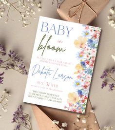 a baby is born card next to some flowers