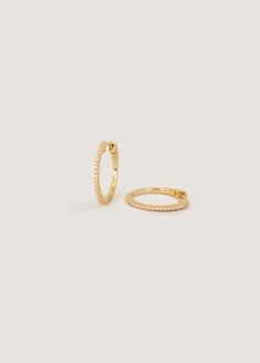 Classic hoops featuring natural pavé diamonds for added texture and elegance—wear alone or stack alongside huggies and studs. 14k solid gold—always Weight: 2.7g Inner diameter: 15mm Thickness: 1.3mm Natural Diamonds Diamond 4 C's: 0.13ctw, Round, SI, G/H, Excellent Nameplate Bracelet, Diamond Guide, Anniversary Jewelry, Domed Ring, Diamond Hoop Earrings, Emerald Jewelry, Engagement Ring Wedding Band, G H, Huggies Earrings