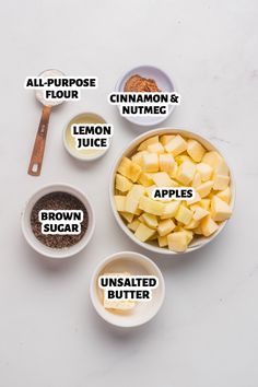 the ingredients to make apple cider are shown in bowls on a white table top