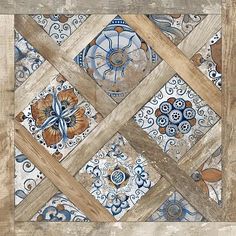 an artistic tile design with wood and blue flowers on the floor, in a square pattern