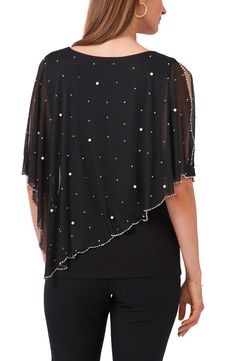 Add a layer of playful elegance with this asymmetric, cape-like top covered in sparkling beads and pearly baubles. 22" length Jewel neck Elbow-length sleeves 96% polyester, 4% spandex Hand wash, line dry Made in the USA Elegant Summer Top With Cape Sleeves, Chic Evening Tops With Cape Sleeves, Chic Evening Tops With Pearl Embroidery, Chic Beaded Tops For Evening, Spring Evening Top With Pearl Embroidery, Chic Cape Sleeves Party Top, Pearl Embroidered Evening Top For Spring, Chic Party Tops With Cape Sleeves, Elegant Party Tops With Cape Sleeves