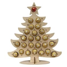 a wooden christmas tree with chocolates in it