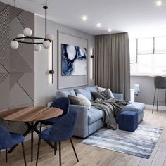 a living room filled with furniture next to a dining table and two chairs in front of a window