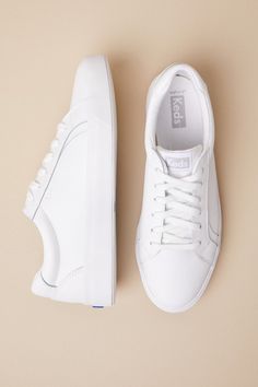 All of your cutest casual looks will pair to perfection with the Keds Pursuit White Leather Lace-Up Sneakers! Smooth genuine leather shapes these cute kicks with a rounded toe upper, a classic lace-up vamp, and a low-cut collar. Seam detailing throughout lends an elevated look, all atop a bumper sole. 1. 25" rubber heel. Cushioned insole. Rubber sole has nonskid markings. Genuine leather upper, balance man made materials. Imported. Lulus | Pursuit White Leather Lace-Up Sneakers | Size 6.5. Plain White Sneakers, White Keds, Mom Apparel, White Tennis Shoes, Lulu Fashion, White Leather Sneakers, White Sneakers Women, Floral Heart, Rubber Heels