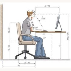 a man sitting at a desk with a computer on it and measurements for the chair