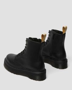 Find DR. MARTENS Vegan Jadon Ii Boot Mono Platforms on Editorialist. A full-volume revamp of our iconic original boot, the Jadon Boot retains all the 1460's signature details — 8-eyes, grooved edges and welt stitching — and adds a towering platform sole. In a monochrome vegan-friendly colorway, this edition loses the leather but none of the attitude. With a side zip for easy wear, the boot has a vegan scripted heel loop that contrasts sharply with the all-black silhouette. A fearless evolution of our 8-eye boot — elevating the silhouette to unmissable new heights. Stand taller. Feel bolder. Felix Rub Off is our go-to vegan material – a synthetic material with a matte finish. Standing at 2 inch with a chunky commando tread — the Quad Retro sole was built to empower. Seen on our smash-hit Ja Jadon Boots, Full Volume, Suit Bag, Black Platform Boots, Black Silhouette, Goodyear Welt, Wedge Boots, Women Perfume, Beauty Bag