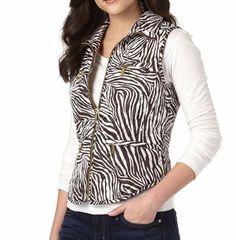 Details & Care This puffer vest with zebra print from Michael Kors will help keep you warm and fashionable this winter. Bold patterning and gleaming zips add polish to a sporty diamond-quilted vest styled for a fitted silhouette with a curved, shirttail hem. 22 1/2" regular length (approx) Front zip closure. Four zip-welt pockets. Fully lined, with 100% polyester fill. 100% polyester. Dry clean or machine wash warm, tumble dry low. By MICHAEL Michael Kors; imported. IMPORTANT INFORMATION · Blouse Tops Designs, Turtleneck Sleeveless, Vest Fashion, Mock Turtleneck, Basic Tops, Puffer Vest, Zebra Print, Stripe Print, Front Zipper