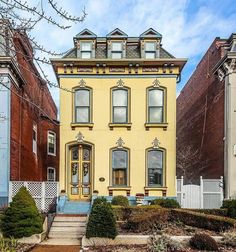 this is an image of a yellow house in the neighborhood that looks like it has been painted