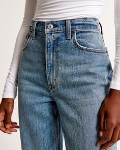 On-trend 90's-style ultra high rise straight jeans with built-in stretch for superior comfort featuring our highest rise that sits at your natural waist and looks great with your shirt tucked or untucked. With refined details and a vintage feel from top to bottom, this style features a full length leg, medium wash and frayed hem. High Waist Rigid Denim Bottoms For Everyday, Straight Bottoms For Everyday Summer Wear, Everyday Medium Wash Bottoms With Straight Hem, High Rise Straight Fit Summer Bottoms, Classic Everyday Mom Fit Bottoms, High-rise Straight Fit Bottoms For Summer, Classic Mom Fit Bottoms For Everyday, High Rise Rigid Denim Bottoms For Everyday, Everyday High Waist Mom Fit Bottoms