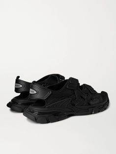 The stacked tread soles on Balenciaga's 'Track' sandals might look familiar, they're moulded like those on the label's popular namesake sneakers. They're made from layers of neoprene and rubber, and have logo-debossed Velcro® straps. This substantial pair looks cool with or without socks. Balenciaga Track Black, Balenciaga Sandals, Balenciaga Men, Latest Sandal, Sandals For Men, Rubber Sandals, Balenciaga Track, Balenciaga Black, Balenciaga Shoes