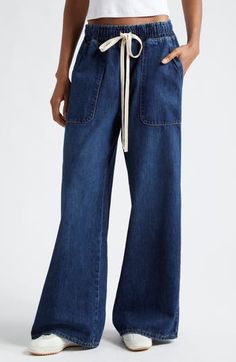 Deep pockets lend utility style to these wide-leg pants cut from nonstretch denim with an adjustable drawstring waist. Elastic/drawstring waist Front slant pockets; back patch pockets 100% cotton Dry clean Made in the USA Relaxed Fit Wide Leg Jeans With Drawstring, Wide-leg Denim Bottoms With Drawstring, Casual High Rise Wide Leg Pants With Patch Pockets, Wide Leg Denim Bottoms With Drawstring, Casual High-rise Wide Leg Pants With Patch Pockets, Relaxed Fit Wide Leg Flare Jeans With Patch Pockets, Wide-leg Denim Jeans With Drawstring, Wide Leg Denim Jeans With Drawstring, Utility Style Wide Leg Flare Jeans With Patch Pockets