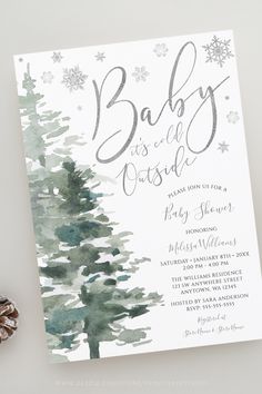 a baby is coming card with a pine tree and snowflakes in the background