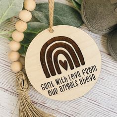 a wooden ornament that says, set with love from our angels above