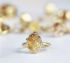 A tiny raw citrine crystal is picked with intention and set on a delicate gold band with an organic style setting. ⭐️  Each ring is made by hand and finished with an ultra heavy, nickel free 14k gold plate. Our 14k gold plate is 20 times thicker than most commercial jewelry and intended to last. Stones are about 1/3 inch in size. Please keep in mind that they are natural, so will vary in exact shape, color and size. No two are alike, but all are equally beautiful.Every item purchased arrives in Citrine Birthstone Ring, November Birthstone Ring, Raw Stone Jewelry, Raw Crystal Ring, Raw Citrine, Raw Stone Ring, Raw Rose Quartz, Citrine Jewelry, Ringe Gold