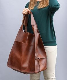 "LARGE SHOULDER BAG, Big Hobo Bag, Oversize Weekender Bag, Large Leather Tote, Everyday Foldover Bag, Handbag Women, Women Leather Bag OVERSIZE STYLISH TOTE BAG made from high quality natural leather. Very roomy interior provides a lot of space for all the daily essentials and more. It is large enough to hold all your weekend essentials. This bag is a great option as your everyday bag. It can fit easily A4 files (US Lettel format), books, magazines, cosmetic bag, accessories, your Macbook / Ipad Foldover Bag, Brown Leather Tote Bag, Slouchy Tote, Matt Brown, Vintage Tote Bag, Leather Weekender, Large Leather Tote Bag, Soft Leather Bag, Stylish Tote Bag