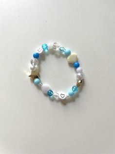 ️ MERMAID TURQUOISE MODEL ️ This fun and colorful bracelet will match any outfit and add a hint of joy to your day. A great gift to give yourself or your friends 🫶 Each product is unique, some beads may vary to guarantee the uniqueness of your necklace. 👀 PRODUCT DETAILS: * Resin beads * Elastic thread * Bracelet circumference: 16 cm 💌 SENDING: FREE DELIVERY Your necklace will be placed in a cotton bag made from fabric scraps then packaged in a small 100% recycled, recyclable or reusable card Playful Turquoise Beaded Bracelets With Colorful Beads, Playful Turquoise Beaded Bracelets, Ocean-inspired Bracelets With Colorful Beads For Gifts, Playful Beaded Turquoise Bracelets, Ocean-inspired Bracelets With Colorful Beads As Gifts, Ocean-inspired Beaded Bracelets With Round Beads, Trendy Round Beads Crystal Bracelet For Beach, Ocean-inspired Beaded Round Bead Bracelets, Ocean-inspired Beaded Round Bracelets