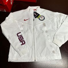 Nike Mens White Ck4552-100 Team Usa Full Zip Windbreaker Jacket Size Xs M Brand: Nike Department: Men Size: Xs M Color: White Type: Jacket Style: Windbreaker Pattern: Solid Theme: Classic Season: Winter, Fall Features: Full Zip Sleeve Length: Long Sleeve Condition: New With Tags I Offer Discounts For All Return Customers. - Jvs White Functional Sport Coat For Winter, White Functional Winter Sport Coat, Nike White Outdoor Outerwear, Nike White Outerwear With Pockets, White Nike Outerwear With Pockets, White Techwear Track Jacket For Winter, Urban White Track Jacket With Pockets, White Track Jacket With Pockets For Outdoor, White Outdoor Track Jacket With Pockets