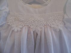 Sophie is one of our cotton embroidered lace christening, baptism, blessing gown! This baby girl dress is made of delicious white embroidered cotton. Sophie baby girl dress is perfect for a warm sunny day and will make any little infant girl feel beautiful! Just look at the embroidery on the skirt of this infant christening, baptism, blessing gown! The lace across the high yolk is a perfect match for the lace on the skirt of this baby girl gown. The laces just adds to the elegance of this infant Spring Lace Baptism Dress With Lace Collar, Fitted Baptism Dress With Lace Work For Spring, Summer Baptism Dress With Lace Work, Fitted Baptism Dress With Lace Trim For Church, Fitted First Communion Dress With Lace Trim For Church, Lace Baptism Dress With Lace Collar, Lace First Communion Dress For Church, Fitted Embroidered Baptism Dress For Summer, Embroidered Fitted Baptism Dress For Summer