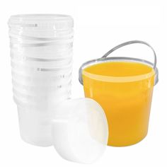 plastic containers with lids are stacked on top of each other and one is filled with orange juice