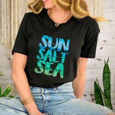 Sun Salt Sea Beach Shirt, Beach Shirt, Summer Shirt, Summer Vibes, Beach Party Shirt, Beach Vibes, Family Beach Shirt, Shirt for the Beach --How To Order-- 1-) Please, Check and Review all Photos. 2-) Choose Your T-Shirt Size and Model From the "Size" Menu. 3-) Choose Your T-Shirt Color from "Primary Color" Menu. 4-)Choose the quantity as much as you want. 5-) Click ADD TO CART. You can go back to add more product color for your family members anytime you want, or you can complete the checkout process. 6-) Please click the "Proceed to Check Out" button 7-) Finally, Processing time is 1-3 days. Shipping time is based on the shipping type you'll select at checkout. -When you check out, you can add a note to seller for any request. -The shirts are very high quality and super soft comfortable Casual Hawaiian Shirt With Letter Print, Casual Beach Shirt, Black Crew Neck Camp Shirt For Summer, Summer Cotton Hawaiian Shirt With Letter Print, Summer Hawaiian Cotton Shirt With Letter Print, Casual Crew Neck Hawaiian Shirt For Summer, Black Shirt For Beach Season, Casual Hawaiian Shirt With Graphic Print For Beach, Black Beachy Tops For The Beach