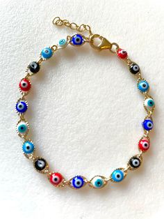 Dainty petite evil eye chain link bracelet with cobalt blue, aqua, red, white and black tiny enameled evil eyes. Delicate evil eye gold link bracelet closes with 14k gold fill lobster claw clasp and 1 inch extension. Black Evil Eye Bracelet, Black Evil Eye, Gold Link Bracelet, Protection Amulet, Aquamarine Earrings, Evil Eyes, Bracelet Dainty, Gold Link, Bracelet Blue