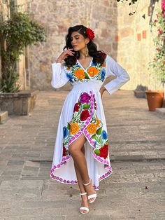 This Beautiful Mexican Floral Dress is the perfect dress for a special event or Mexican Fiesta. It reflects the Mexican culture through its unique design and vibrant colors.  It has elastic on the back for an adjustable fit and is embroidered by Artisanal Machine by Mexican Artisans in Guanajuato, Mexico. It's made out of fresh Mexican cotton, is full of embroidered multicolor flowers. This is A-line dress. Size S - XL Shop more Mexican Dresses here:  https://www.etsy.com/es/shop/SoleiEthnic?ref Mexican Embroidery Dresses, Mexican Quince Theme, Mexican Wedding Dress Embroidered, Mexican Fashion Modern, Mexican Theme Party Outfit, Mexican Inspired Dress, Mexican Dresses Traditional, Mexican Traditional Dress, Mexican Fancy Dress