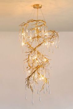 a chandelier with lights hanging from it's sides and branches in the middle