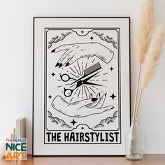 the hairstylist poster is displayed on a shelf next to a vase with dry grass