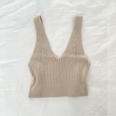 Super Chic Ribbed Knit Top In A Creamy Tan Color! This Tank Top Is Perfect As An Elevated Basic And Is Super Comfortable. Brand New~ Labeled As A Size M. #Chic #Minimalist #Classy #Feminine #Fallfashion Beige Ribbed V-neck Top, Cozy Ribbed Fitted Knit Top, Cozy Fitted Ribbed Knit Top, Ribbed Beige Knit Top, Beige Seamless Knit Top, Seamless Beige Knit Top, Beige Soft Knit V-neck Top, Beige Knit V-neck Top, Cozy Ribbed Beige Top