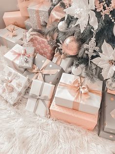 many presents are wrapped in pink and silver paper