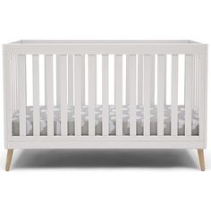 a white crib with wooden legs and sheets on the bottom, in front of a white background