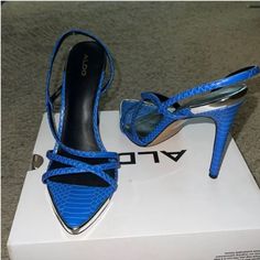 Blue Snake Print Heels . The Heels Are Comfortable And Classy , They Can Be Worn For Different Occasions . Luxury Chic Heels With Snake Print, Leather Snake Print Round Toe Heels, Blue Block Heels, Tan Mules, Chic Snake Print Heels, Trendy High Heel Snake Print Heels, Block Heel Platform Sandals, Elegant Snake Print High Heels, Aldo Heels