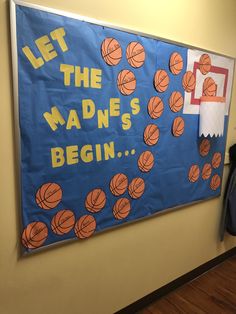 a bulletin board with basketballs on it and the words let the madnes begin