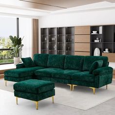 a living room with a green couch and ottoman