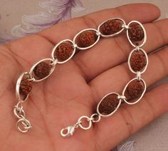 Made by   SHREEJAIPURSILVER925 Designed By  Make Mom's last-minute gift more thoughtful with a gift teaser NEW spring fashion https://shreejaipursilver925.etsy.com Rudraksha Bracelet, Om Charm Bracelet,925 Sterling Silver Rudraksha Beads Bracelet, Om Bracelet, Sterling Silver Bracelet, Handmade Bracelet #holidaytable #cyberweek #thanksgivingdecor #challenge #Chrismtasgift #Bridesmaid #Anniversary #Birthday #readytogift #Birthstoneitem #ringforwoman #Fastersellingitem #Bestseller #silverartisanwo Hand-strung Round Sterling Silver Bracelet Gift, Spiritual Sterling Silver Bracelets With Polished Beads, Spiritual Oval Sterling Silver Bracelet, Thanksgiving Challenge, Rudraksha Bracelet, Om Bracelet, Om Charm, Rudraksha Beads, 20 Gifts