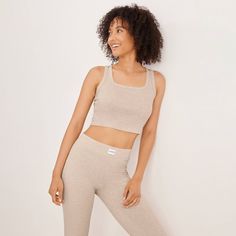 This Organic Cotton Stretch Lounge Tank Top from Jockey Generation™ makes a cozy addition to your activewear wardrobe. Made from organic cotton with added spandex for stretchy comfort, this sleeveless tank top features a scoop neckline and a cropped length. It's perfect for both working out and kicking back at home, and the solid hue makes it easy to pair with any of your favorite pants, leggings or shorts. Medium Support Seamless Cotton Activewear, Seamless Cotton Activewear With Medium Support, Comfortable Fitted Everyday Activewear, Comfortable Fitted Activewear For Everyday, Cozy Cotton Activewear With Ribbed Waistband, Sporty Everyday Activewear With Medium Support, Sporty Activewear With Medium Support For Everyday, Comfortable Fitted Activewear For Loungewear, Fitted Activewear For Loungewear