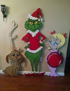 the grinch family is standing next to each other