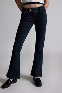 Elevated essential BDG jeans in a tailored, flare silhouette. Designed with a low rise waist, double-button extended-tab fly and flat, back pockets for a tailored, streamlined look. Exclusively at Urban Outfitters. Features BDG Brooke flare pants Low rise flare trouser jeans Lightweight denim with medium stretch Low rise waist with belt loops and extended tab fly Slant front pockets Full length flared leg Flat welt back pockets Zip fly and double button closure UO exclusive Content + Care 79% Co Mid-rise Dark Wash Flares With Five Pockets, Classic Flare Jeans In Denim Blue, Classic Fitted Dark Wash Flare Jeans, Classic Denim Blue Flare Jeans, Fitted Flare Jeans With Five Pockets, Mid-rise Fitted Denim Blue Flares, Fitted Mid-rise Denim Blue Flares, Classic Fitted Denim Flare Jeans, Classic Mid-rise Dark Wash Flare Jeans