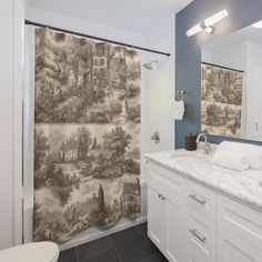 a bathroom with a large shower curtain in it