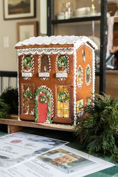 a gingerbread house decorated with christmas decorations