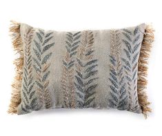 an embroidered pillow with fringes on the front and back, in grey and beige