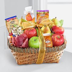 a basket filled with lots of fruit and snacks