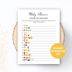 baby shower game with emoj pictionary printables on the front and back