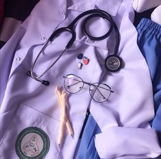 a doctor's uniform and medical supplies are laid out