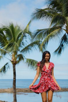 Red Floral Mini Wrap Dress Hawaiian V-neck Dresses For Vacation, Red Hibiscus Print Dress For Vacation, Fitted Tropical Print Dress For Vacation, Beachy Maxi Dress For Holiday, Tropical Print Dress For Holiday, Tropical Print Dresses For Summer Parties, Tropical Print Holiday Dress, Beachy Tropical Print Dress For Poolside, Red Hawaiian Beach Dress